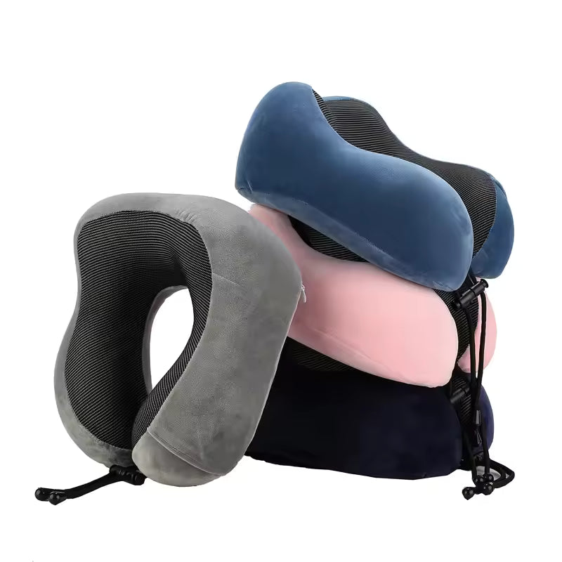 Stack of U shaped memory foam neck pillow in blue gray pink and black colors with adjustable straps