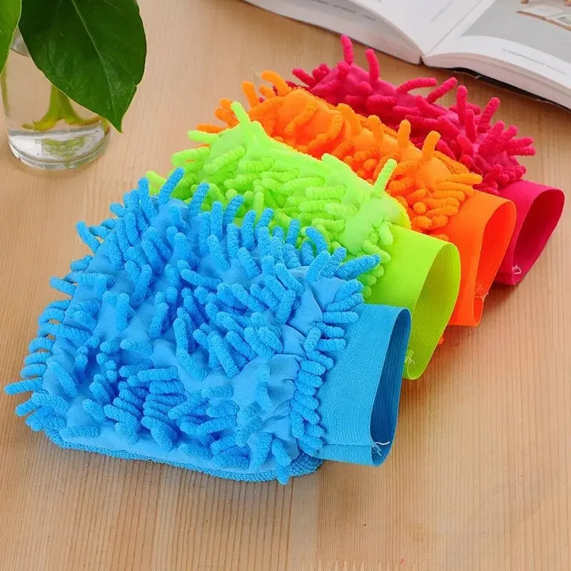 Colorful set of ultrafine fiber cleaning gloves in blue, green, orange, and pink on wooden surface