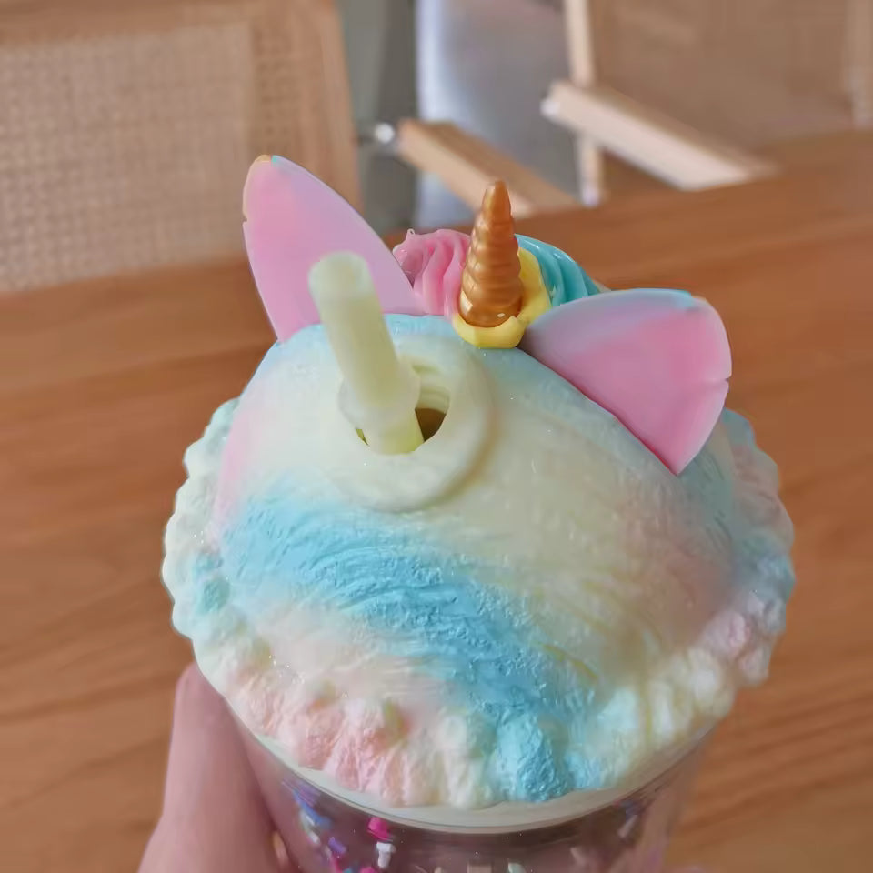 Unicorn water cup with straw featuring pastel ears, horn, and colorful mane lid