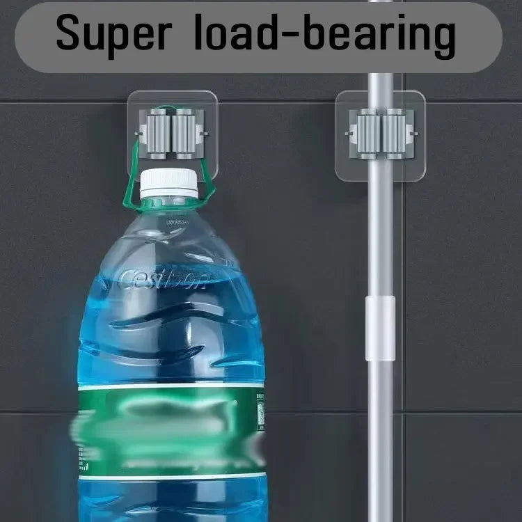 Clarify.pk broom mop wall clips holding a large water bottle and mop on black wall