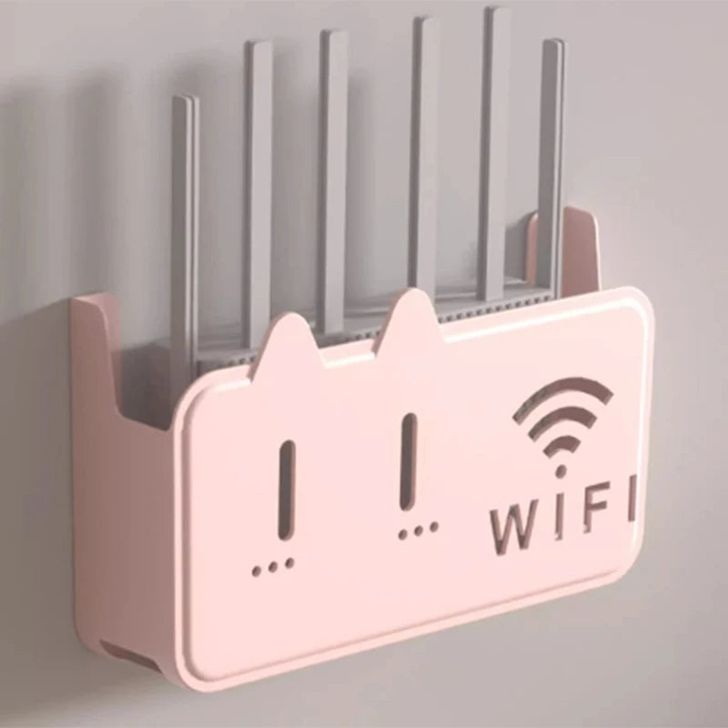 Pink wifi router shelf organizer mounted on wall holding a wi-fi router with antennas