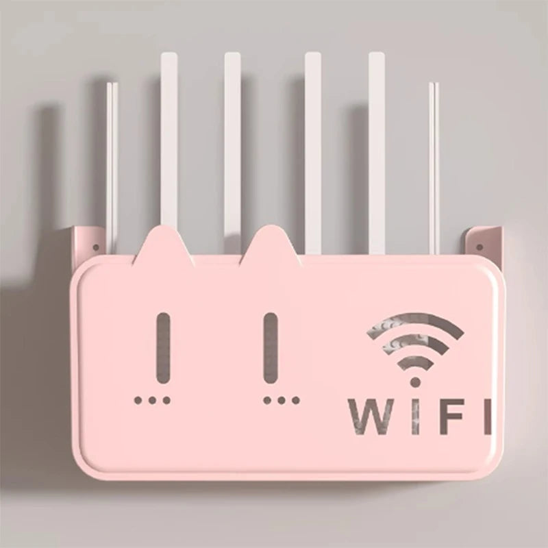 Pink wifi router shelf organizer mounted on wall with multiple antennas and ventilation slots