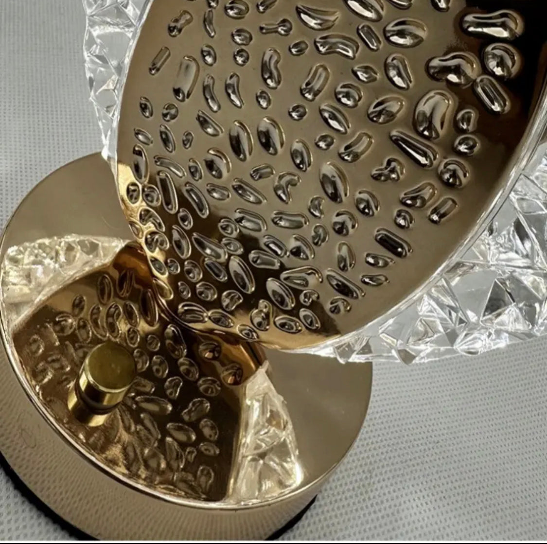 Close-up of Clarify.pk USB cordless desk lamp with gold and crystal textured design base