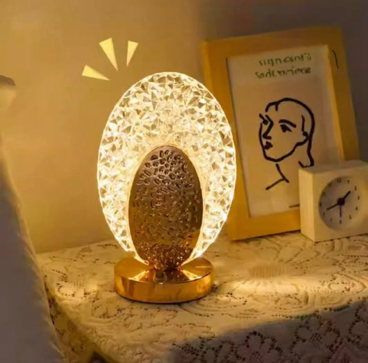 USB cordless desk lamp with decorative crystal design illuminating bedside table