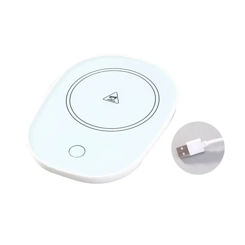 White USB powered cup heater with circular heating surface and USB cable for keeping beverages warm