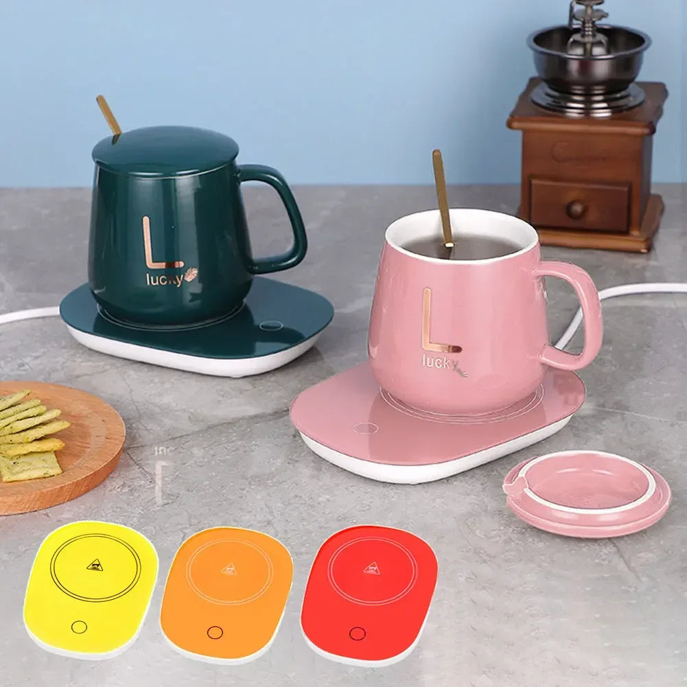 USB powered cup heater with pink and green mugs on heating pads and colorful heater options by Clarify.pk