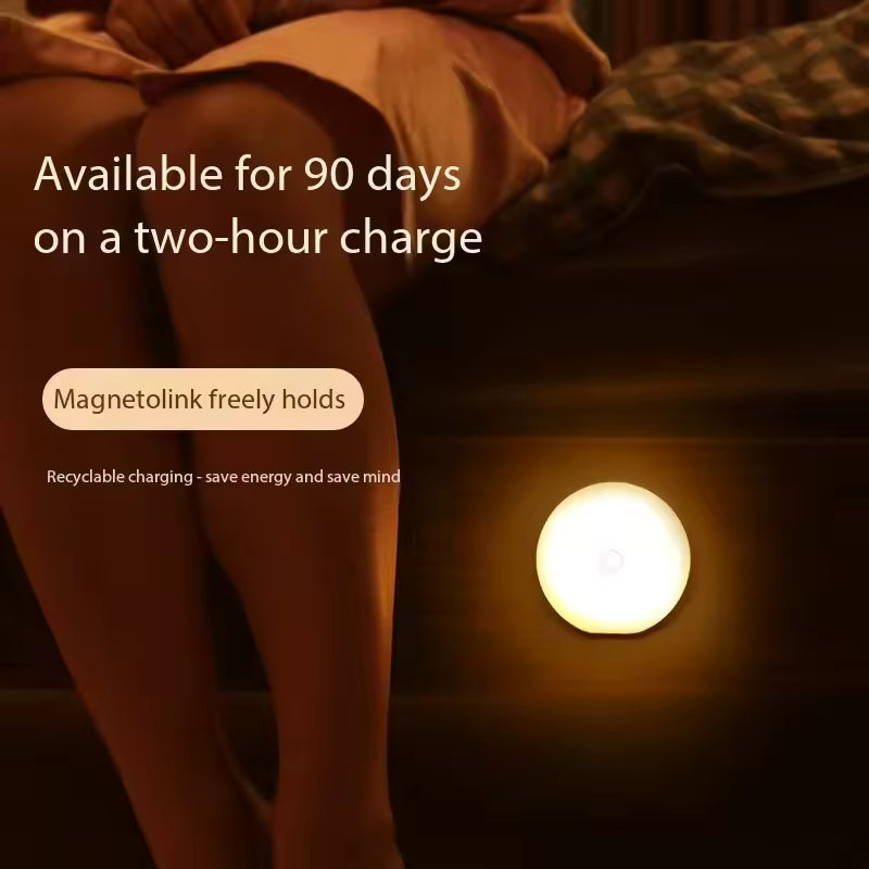 USB rechargeable closet lamp glowing warmly on wooden surface near person sitting at night