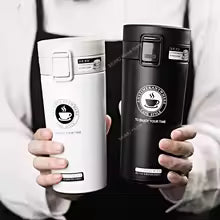 Clarify.pk vacuum insulated coffee thermos flask in black and white held by person