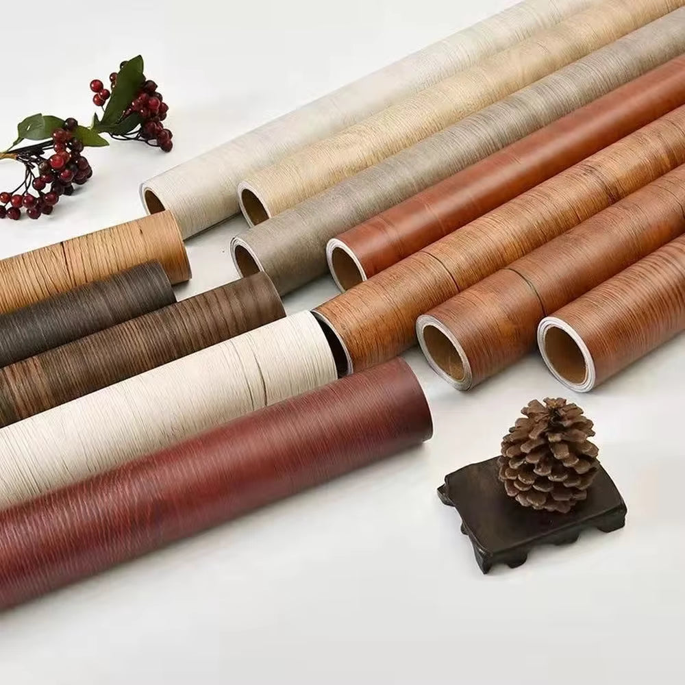 Rolls of wood texture self adhesive furniture stickers in various shades by Clarify.pk