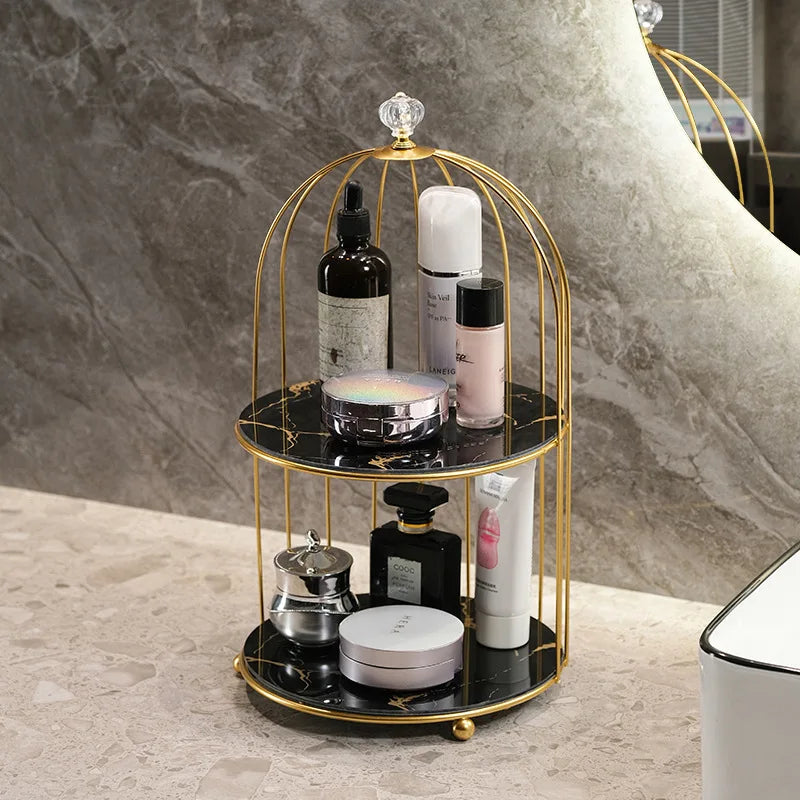 Clarify.pk 2 tier cosmetic storage rack with gold frame and black shelves holding various skincare products