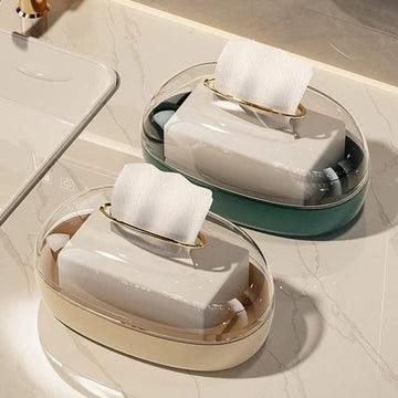 Clarify.pk acrylic tissue box wall-mounted in beige and green with gold handle on marble countertop