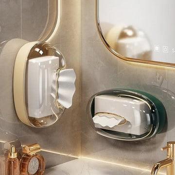 Modern acrylic tissue box wall-mounted in transparent and green colors installed on bathroom walls