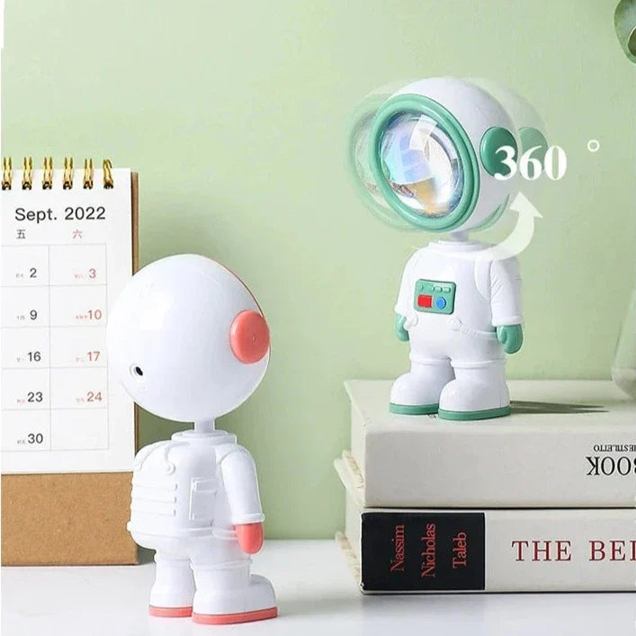 Clarify.pk astronaut starry sunset lamp with 360 degree rotating astronaut design on stacked books