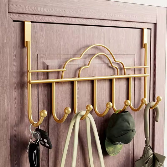 Gold metal behind door hooks for clothes hanging hats umbrella and bags on wooden door