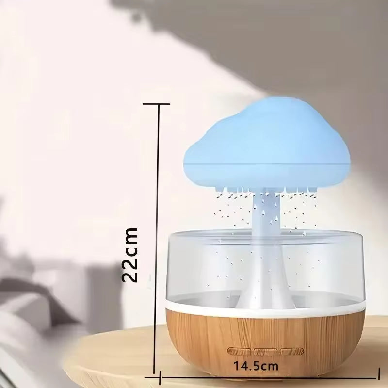 Colorful mushroom cloud humidifier with blue top and wooden base on wooden table with size dimensions