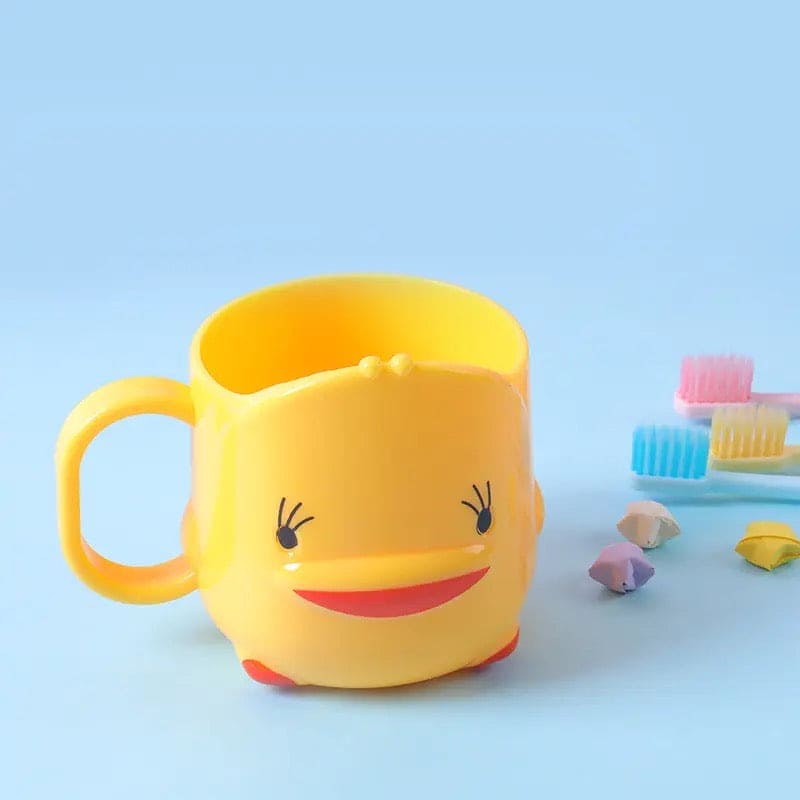 Cute duck toothbrush cup in bright yellow for bathroom interiors holding toothbrushes