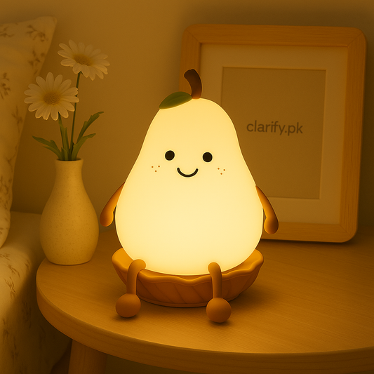 Cute pear night light glowing warmly on a wooden bedside table with a smiley face design