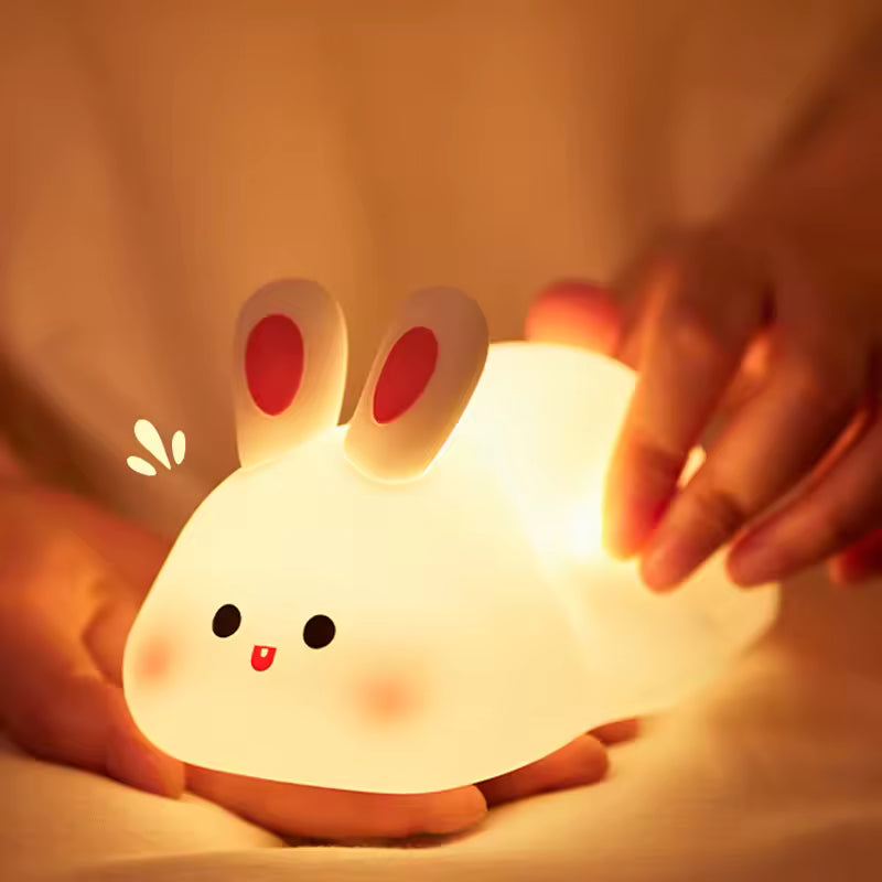 Clarify.pk cute rabbit desk lamp glowing softly held by hands emitting warm light