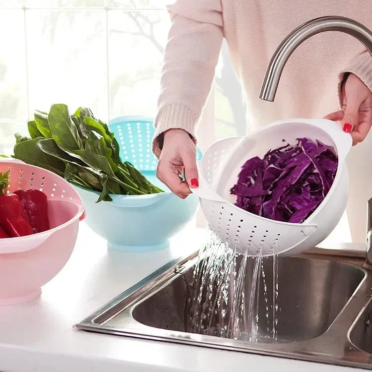 Double layer fruit and vegetable basket in use for washing purple cabbage over kitchen sink