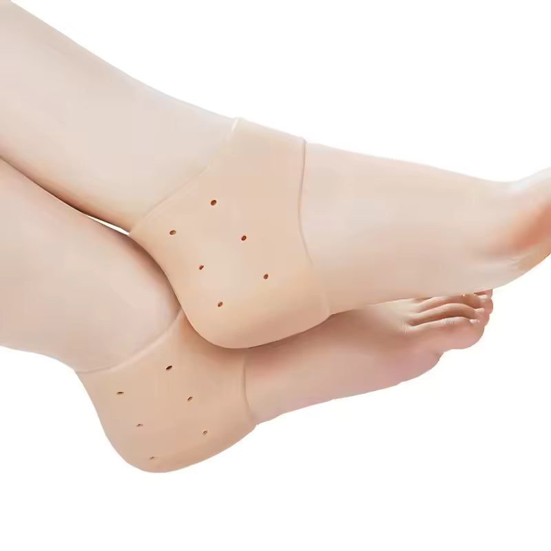 Beige silicone heel socks for cracked heels worn on feet providing cushion and moisture retention