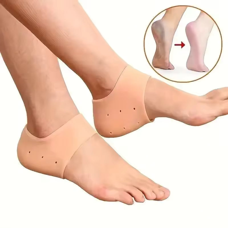 Beige silicone heel socks for cracked heels worn on feet to moisturize and protect dry skin