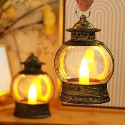 Antique style electronic candle lantern for home decor with warm glowing light inside clear glass