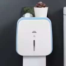 Clarify.pk wall mounted bathroom organizer in white and blue holding toiletries and a small plant