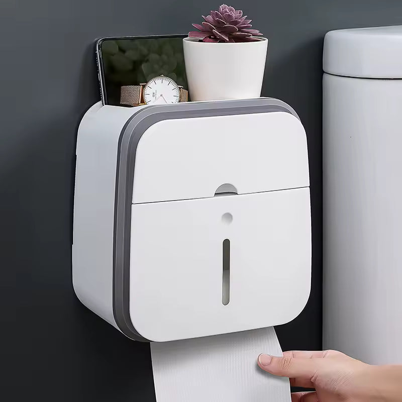 Clarify.pk wall mounted bathroom organizer in white holding phone watch plant and toilet paper
