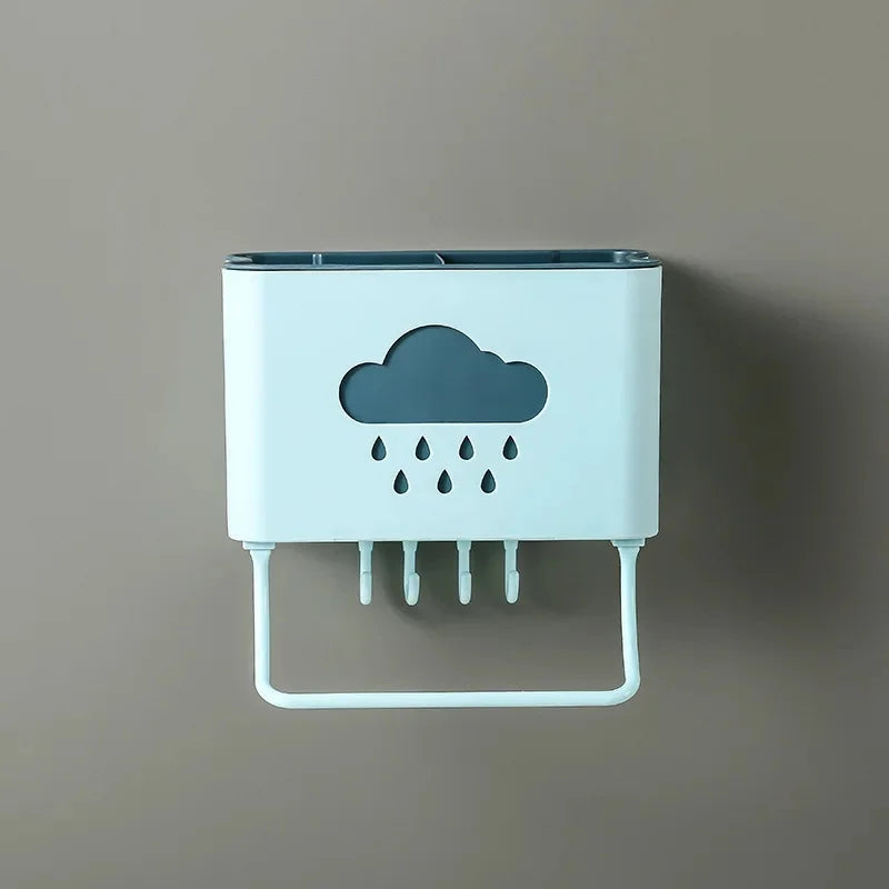 Wall mounted kitchen organizer in white with cloud and raindrop design and multiple hooks for utensils