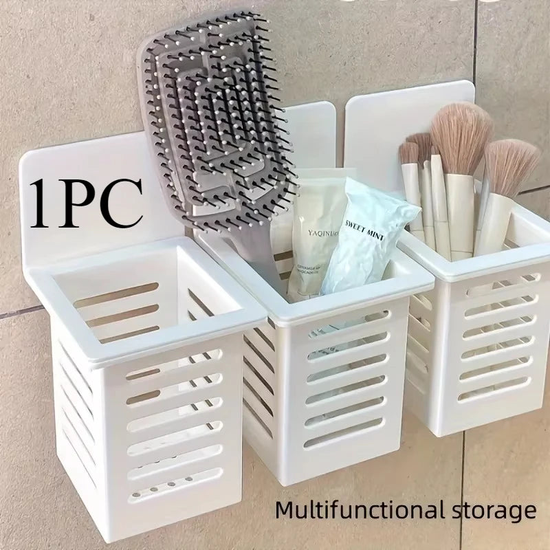 White wall mounted organizer with three compartments holding makeup brushes and hairbrush by Clarify.pk