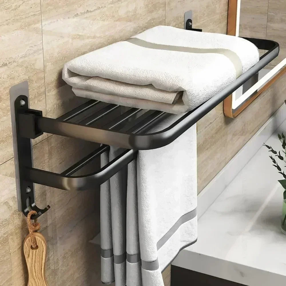 Clarify.pk black wall mounted shower towel rack holding folded and hanging white towels in modern bathroom