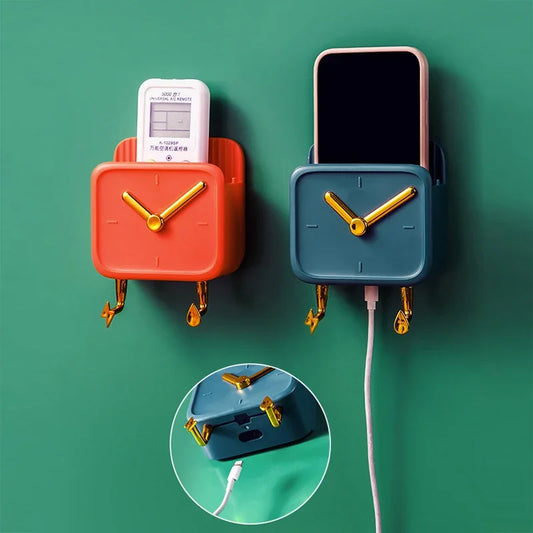 Modern wall mounted storage box in coral and blue with clock face and phone storage on green wall