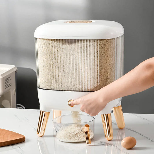 Clarify.pk automatic grain dispenser for kitchen with clear container and gold legs dispensing rice into a glass bowl