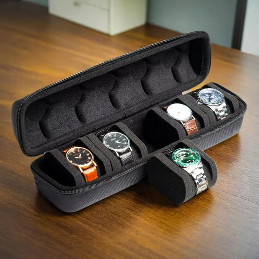 Black watch organizer case 5 slots with soft padding holding five wristwatches on wooden surface