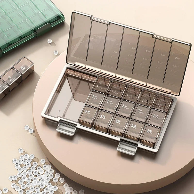 Clarify.pk weekly pill organizer box with multiple clear compartments for daily medication management