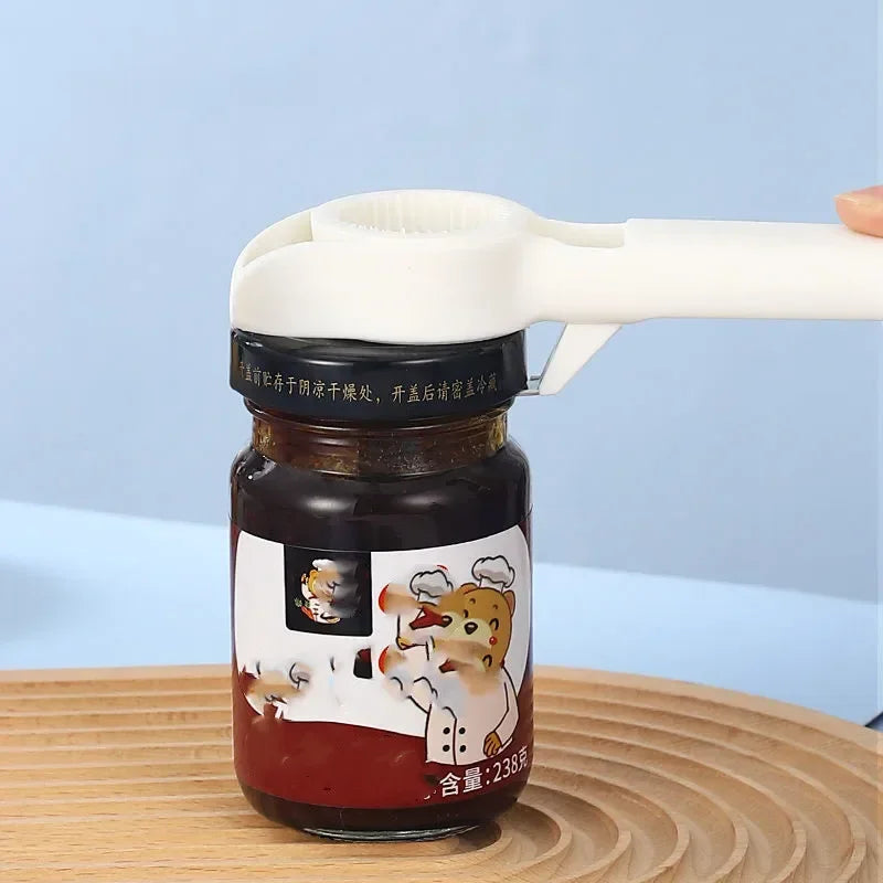 White 4 In 1 Beer Bottle Opener removing lid from glass jar on wooden surface