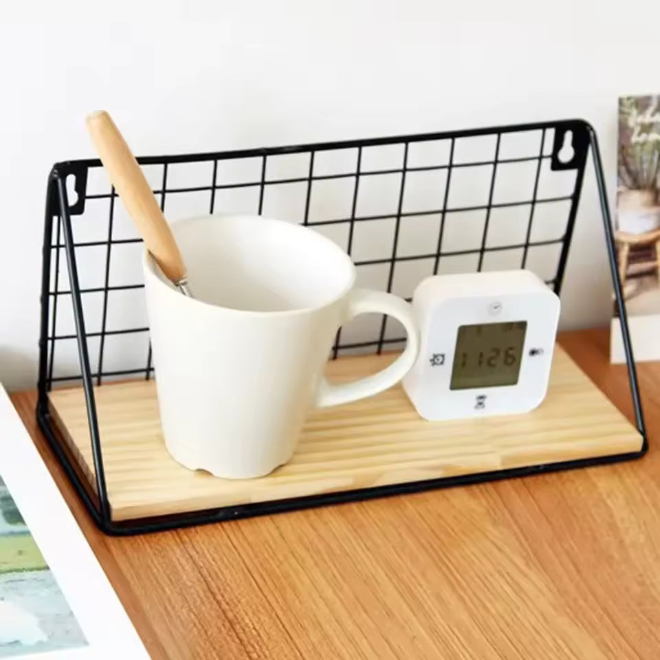 Wooden iron wall shelf with black metal frame holding a white mug and a digital timer on a wooden surface