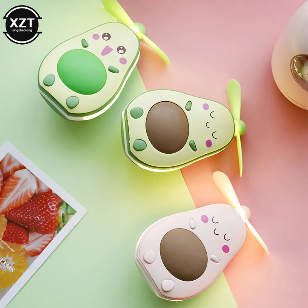 Cute avocado-shaped portable makeup mirror fan in green and white colors with small blades