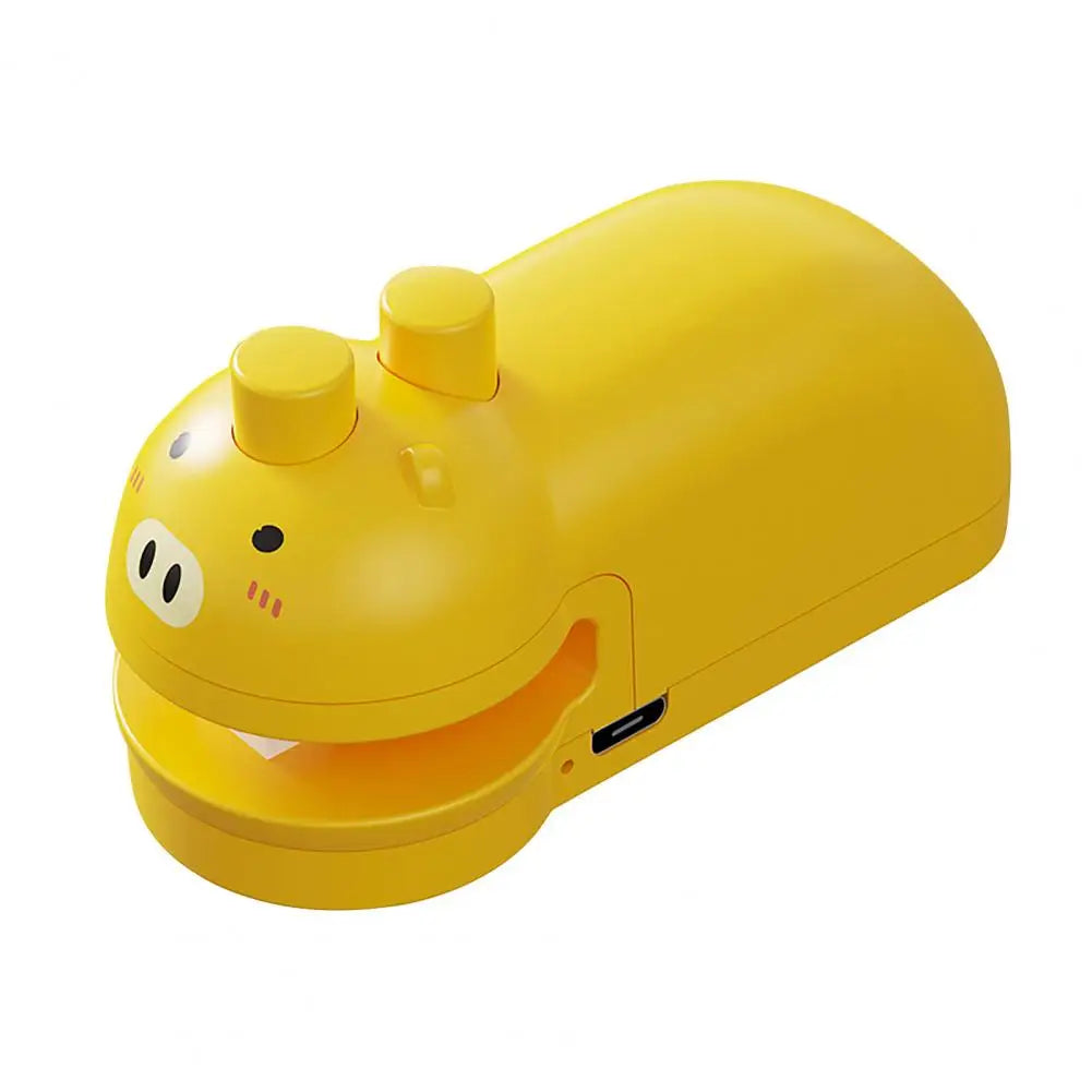 Yellow handheld food sealing device with cute pig design and USB charging port