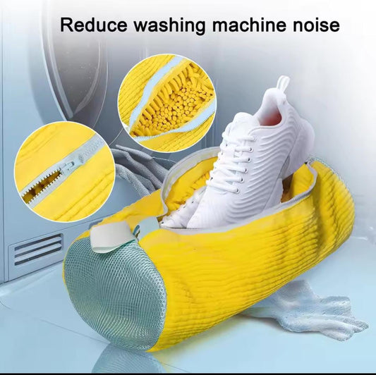 Yellow shoe washing pouch for washing machine with white sneakers inside reducing machine noise
