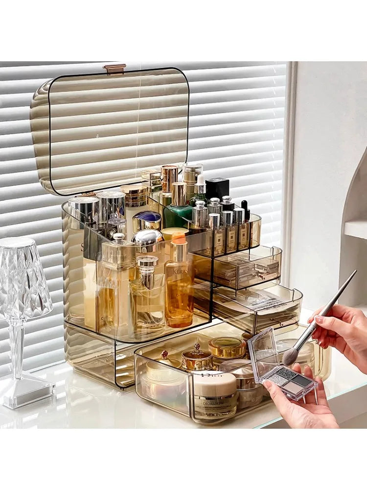 Clarify.pk acrylic cosmetics storage box with multiple compartments holding skincare and makeup products
